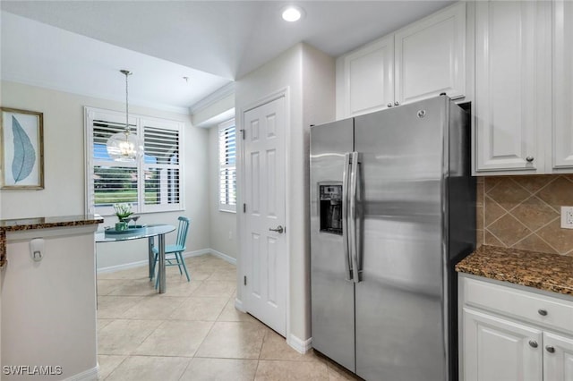 3159 Serena Ln Unit 102, Naples, FL 34114 - kitchen with stainless steel fridge with ice dispenser, white cabinetry, decorative backsplash, dark stone countertops, and baseboards