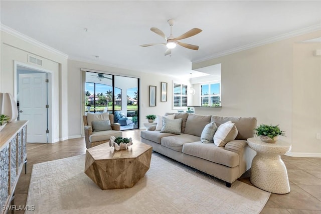 3159 Serena Ln Unit 102, Naples, FL 34114 - living room featuring ceiling fan, plenty of natural light, light tile patterned floors, crown molding, and baseboards