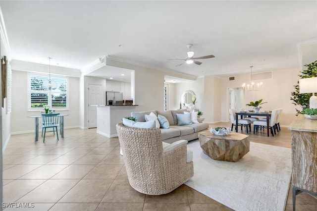 3159 Serena Ln Unit 102, Naples, FL 34114 - living room featuring a chandelier, light tile patterned flooring, ceiling fan, crown molding, and baseboards