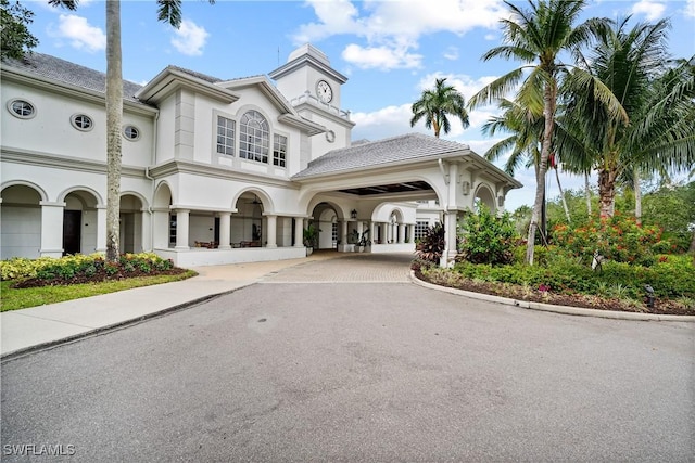 3159 Serena Ln Unit 102, Naples, FL 34114 - view of property featuring asphalt driveway