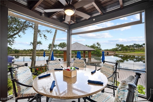 3159 Serena Ln Unit 102, Naples, FL 34114 - sunroom with a water view and wooden ceiling with exposed beams
