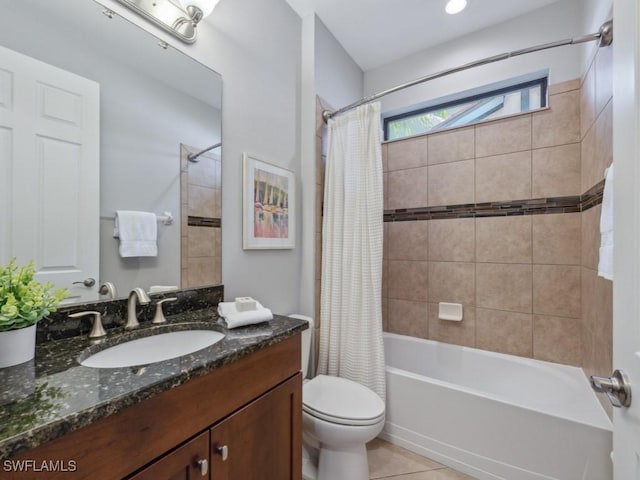 bathroom featuring shower / bathtub combination with curtain, toilet, vanity, and tile patterned floors