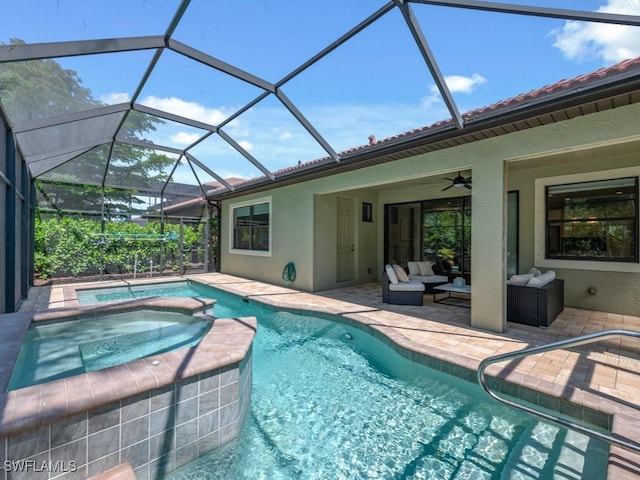 view of pool with a patio, a pool with connected hot tub, an outdoor hangout area, a ceiling fan, and glass enclosure