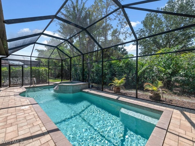 14326 Tuscany Pointe Trl, Naples, FL 34120 - view of swimming pool featuring a pool with connected hot tub, a patio, and a lanai