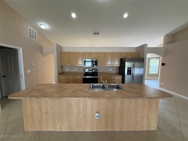 3206 35th St W, Lehigh Acres, FL 33971 - kitchen with stainless steel appliances, a sink, arched walkways, light tile patterned floors, and recessed lighting