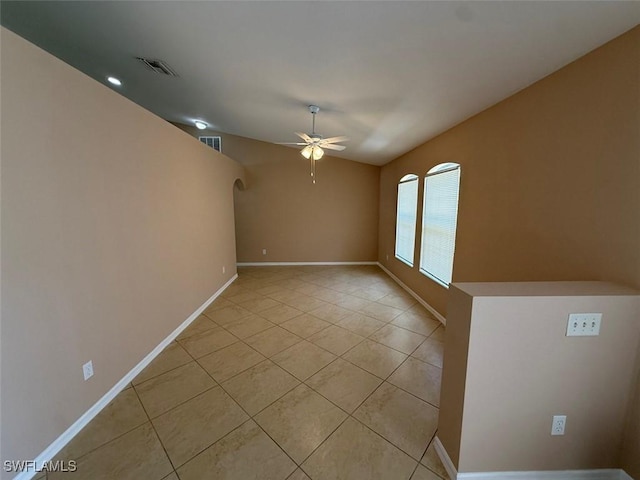3206 35th St W, Lehigh Acres, FL 33971 - spare room with a ceiling fan, light tile patterned floors, baseboards, and arched walkways