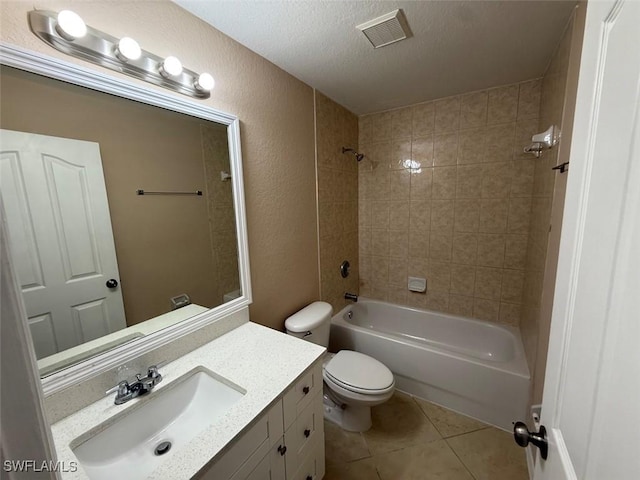 3206 35th St W, Lehigh Acres, FL 33971 - bathroom featuring vanity, tile patterned flooring, toilet,  shower combination, and a textured ceiling