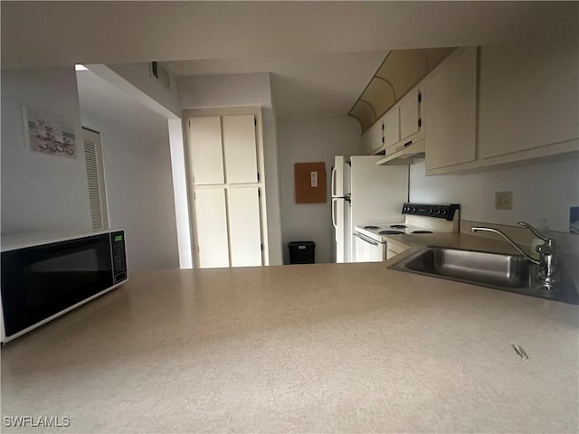 9970 Sailview Ct Unit 19, Fort Myers, FL 33905 - kitchen with white electric range oven, a sink, under cabinet range hood, and light countertops