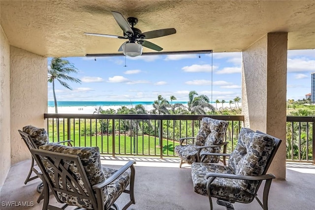 174 S Collier Blvd Unit 304, Marco Island, FL 34145 - balcony with ceiling fan and view of water and beach
