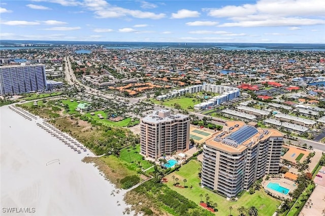 174 S Collier Blvd Unit 304, Marco Island, FL 34145 - bird's eye view of a pool area and a large body of water