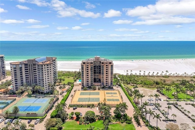 174 S Collier Blvd Unit 304, Marco Island, FL 34145 - bird's eye view of waterfront with a beach and apartment complex