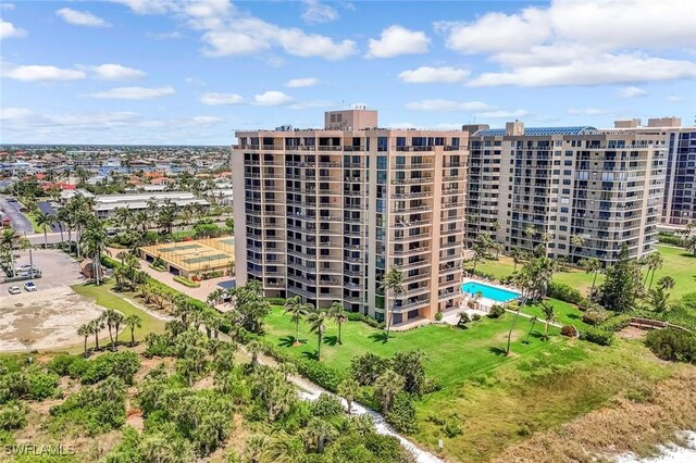 174 S Collier Blvd Unit 304, Marco Island, FL 34145 - drone / aerial view of a pool and apartment complex / building