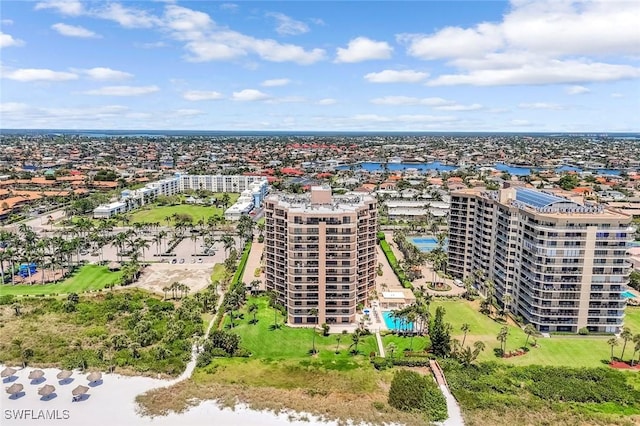 174 S Collier Blvd Unit 304, Marco Island, FL 34145 - drone / aerial view of apartment complex and a pool area