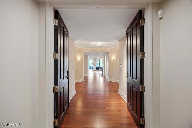 2630 Grey Oaks Dr N Unit B18, Naples, FL 34105 - hallway featuring wood finished floors and baseboards