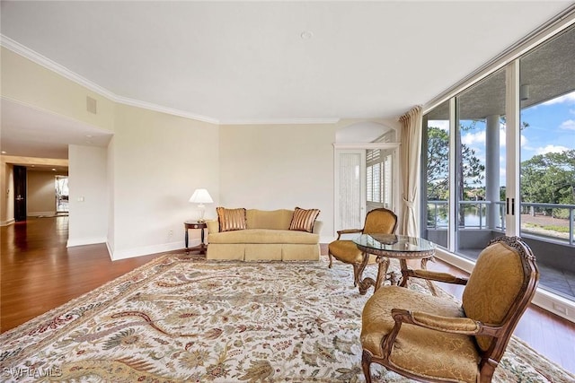 2630 Grey Oaks Dr N Unit B18, Naples, FL 34105 - living area featuring wood finished floors, baseboards, and ornamental molding