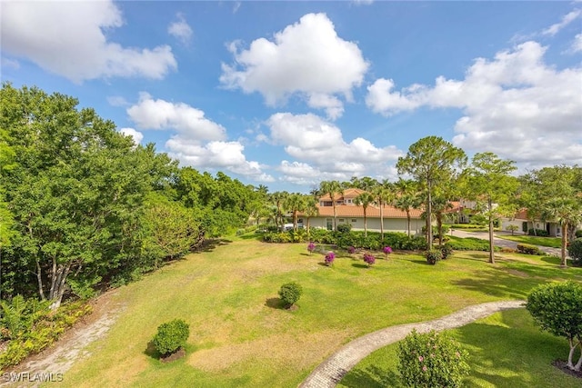 2630 Grey Oaks Dr N Unit B18, Naples, FL 34105 - surrounding community featuring a lawn