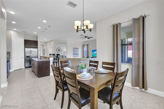 dining area featuring a chandelier, light tile patterned flooring, recessed lighting, ceiling fan, and baseboards