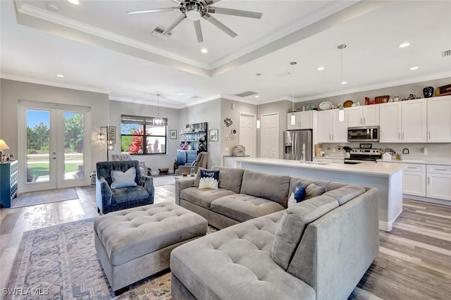 7824 7th Ter, Labelle, FL 33935 - living room with a raised ceiling, recessed lighting, light wood-style flooring, ceiling fan, and french doors