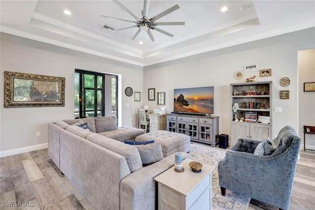 7824 7th Ter, Labelle, FL 33935 - living area featuring a raised ceiling, light wood-type flooring, a ceiling fan, recessed lighting, and baseboards