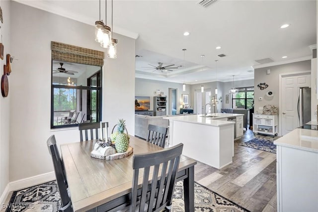 7824 7th Ter, Labelle, FL 33935 - dining area with ceiling fan, ornamental molding, recessed lighting, wood finished floors, and baseboards