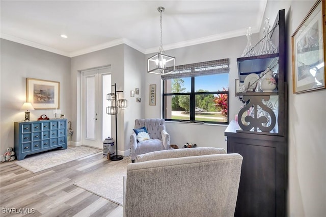 7824 7th Ter, Labelle, FL 33935 - living room featuring wood finished floors, a chandelier, ornamental molding, baseboards, and recessed lighting