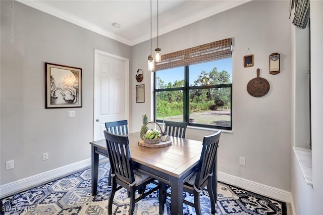 7824 7th Ter, Labelle, FL 33935 - dining area featuring baseboards and crown molding