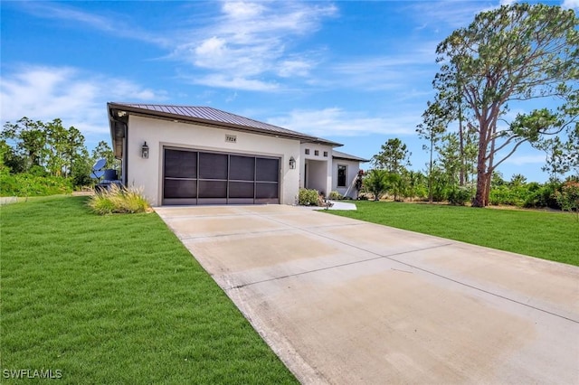 7824 7th Ter, Labelle, FL 33935 - view of front of house featuring stucco siding, a standing seam roof, concrete driveway, and an attached garage