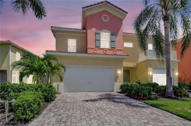 9820 Healthpark Cir Unit 101, Fort Myers, FL 33908 - mediterranean / spanish home with a tiled roof, stucco siding, and decorative driveway