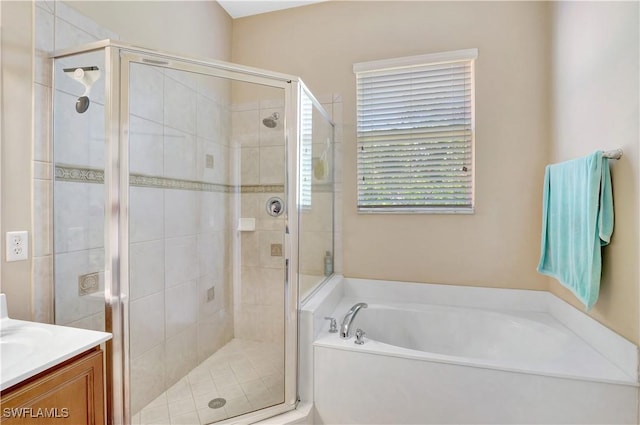 9820 Healthpark Cir Unit 101, Fort Myers, FL 33908 - bathroom featuring a bath, a stall shower, and vanity