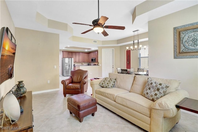 9820 Healthpark Cir Unit 101, Fort Myers, FL 33908 - living room featuring a ceiling fan, a chandelier, light tile patterned floors, and baseboards