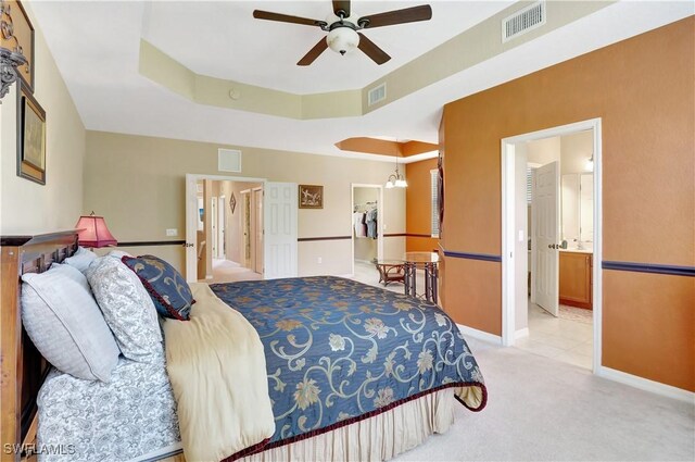 9820 Healthpark Cir Unit 101, Fort Myers, FL 33908 - bedroom featuring carpet, baseboards, ensuite bath, and ceiling fan