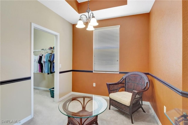 9820 Healthpark Cir Unit 101, Fort Myers, FL 33908 - living area with a chandelier, carpet floors, and baseboards