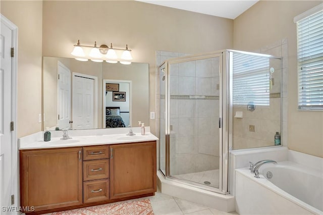 9820 Healthpark Cir Unit 101, Fort Myers, FL 33908 - ensuite bathroom with a stall shower, a bath, double vanity, and tile patterned floors