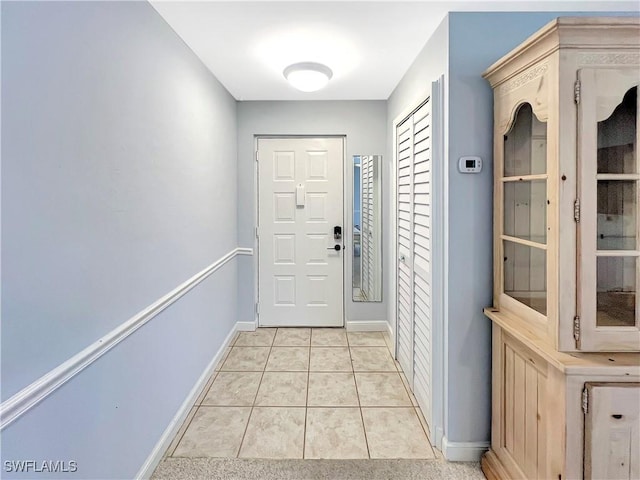 13264 White Marsh Ln Unit 3318, Fort Myers, FL 33912 - doorway featuring baseboards and light tile patterned floors