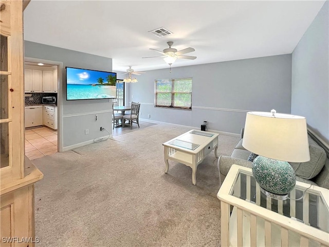 13264 White Marsh Ln Unit 3318, Fort Myers, FL 33912 - living room featuring light carpet, ceiling fan, and baseboards