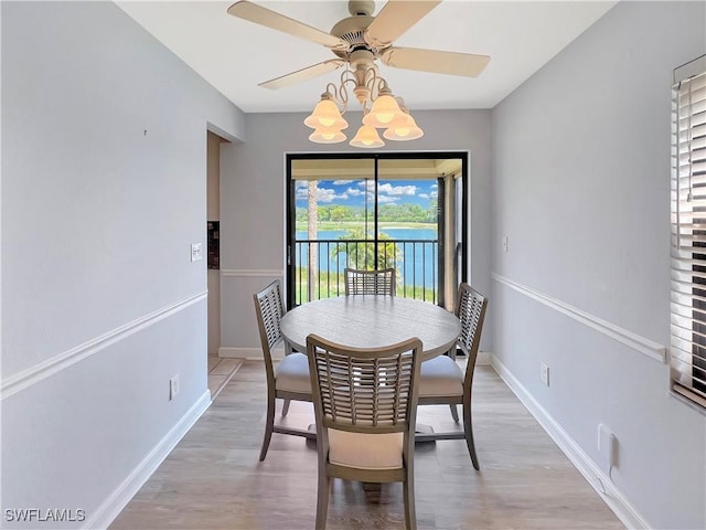 13264 White Marsh Ln Unit 3318, Fort Myers, FL 33912 - dining area featuring a ceiling fan, light wood-style flooring, and baseboards