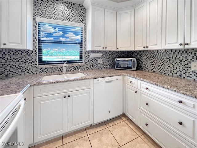 13264 White Marsh Ln Unit 3318, Fort Myers, FL 33912 - kitchen with dishwasher, a sink, stove, light tile patterned flooring, and white cabinetry