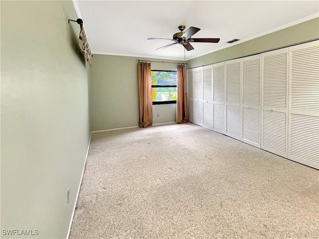 13264 White Marsh Ln Unit 3318, Fort Myers, FL 33912 - unfurnished bedroom with ornamental molding, carpet flooring, baseboards, a ceiling fan, and a closet