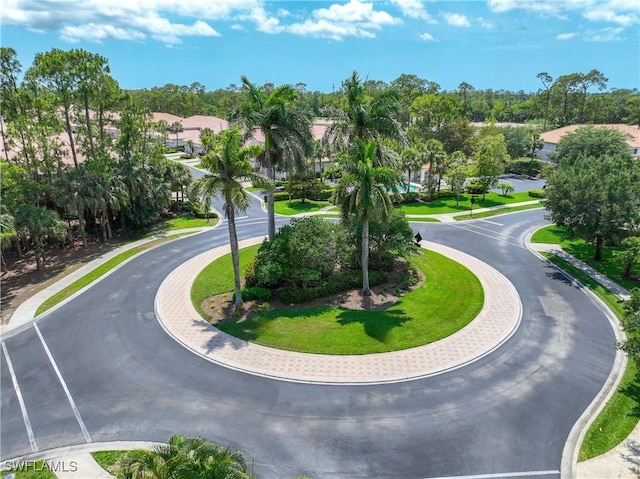 surrounding community with view of wooded area