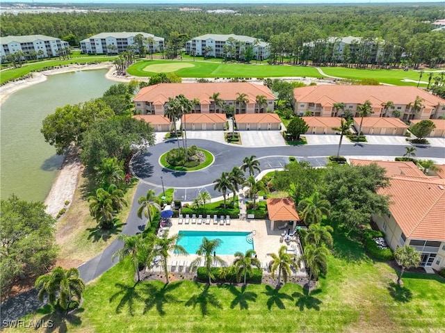 bird's eye view of a pool and a nearby body of water