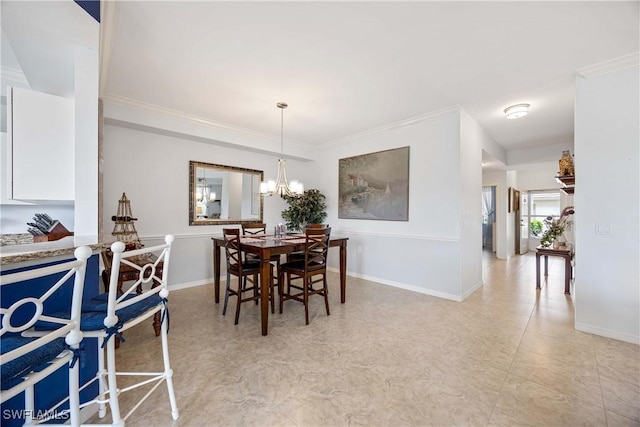 dining area with ornamental molding, baseboards, light flooring, and a chandelier