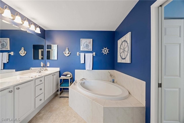 bathroom featuring a garden tub and double vanity