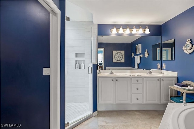 bathroom featuring a stall shower, double vanity, and a bathtub
