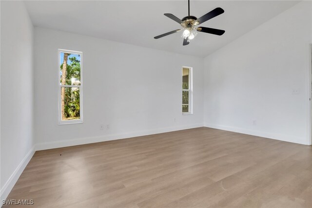 18298 Hepatica Rd, Fort Myers, FL 33967 - empty room featuring light wood-type flooring, a ceiling fan, baseboards, and lofted ceiling