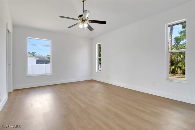 18298 Hepatica Rd, Fort Myers, FL 33967 - empty room featuring light wood-style floors, baseboards, and ceiling fan