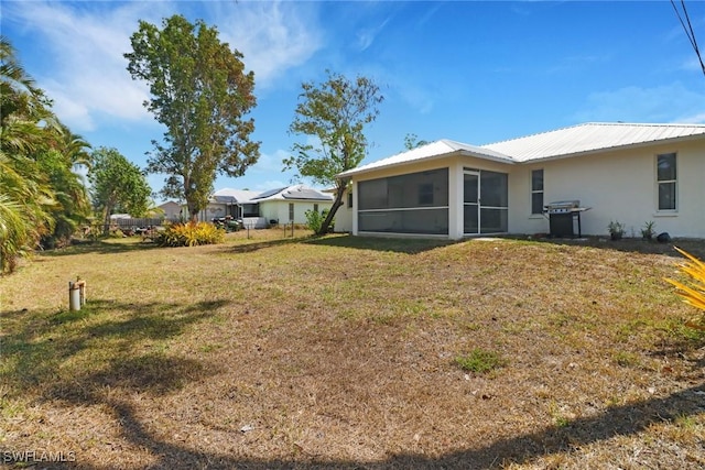 18298 Hepatica Rd, Fort Myers, FL 33967 - view of grassy yard with a sunroom