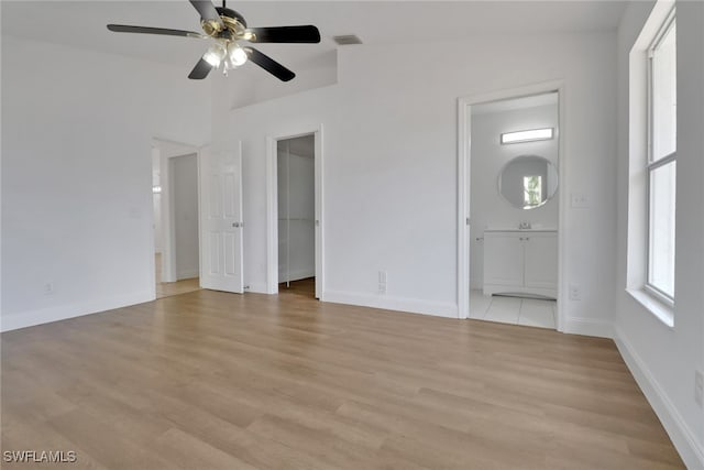 18298 Hepatica Rd, Fort Myers, FL 33967 - unfurnished living room with ceiling fan, light wood-style floors, and baseboards