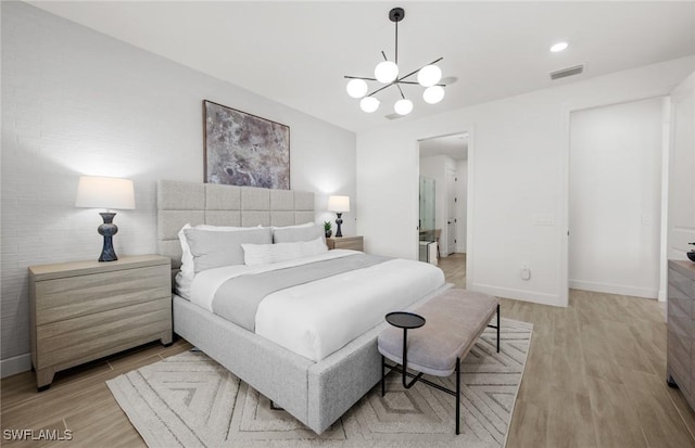 12429 Basalt Ln, Alva, FL 33982 - bedroom with light wood finished floors, a chandelier, and baseboards