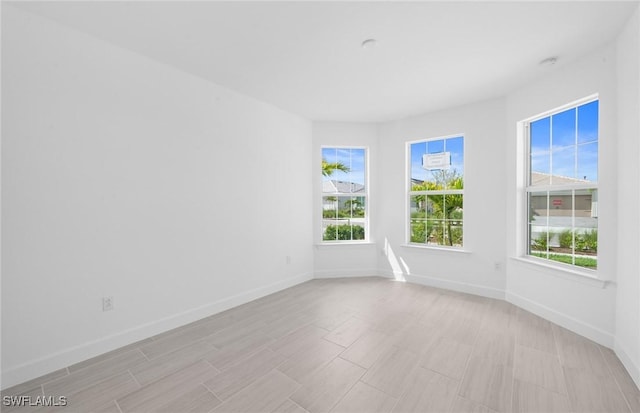 12429 Basalt Ln, Alva, FL 33982 - empty room featuring plenty of natural light and a smoke detector