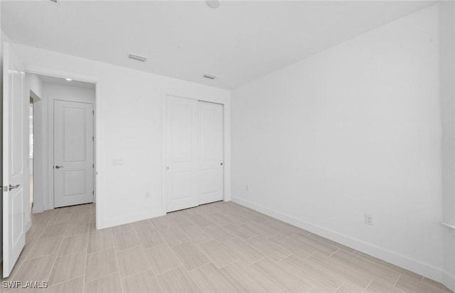 12429 Basalt Ln, Alva, FL 33982 - unfurnished bedroom with baseboards and a closet